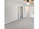 This bedroom features neutral walls, carpet, a ceiling fan, closet, and a bright, open view at 2080 Norwich Pl, Martinsville, IN 46151