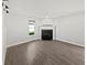 Living room featuring wood floors, a fireplace, and lots of natural light at 2080 Norwich Pl, Martinsville, IN 46151