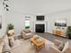 Bright living room features a fireplace, neutral decor, and wood-look floors at 2080 Norwich Pl, Martinsville, IN 46151