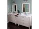 Dual sink bathroom vanity featuring white cabinetry, modern lighting, and spacious countertop at 2120 Dakota Dr, Franklin, IN 46131