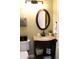 Elegant powder room featuring a granite countertop and a decorative, oval-shaped mirror at 2120 Dakota Dr, Franklin, IN 46131