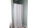 Clean bathroom view of shower stall featuring a white shower curtain and a neutral-toned floor rug at 2120 Dakota Dr, Franklin, IN 46131
