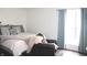 A bedroom with a seating area and a large window with natural light at 2120 Dakota Dr, Franklin, IN 46131