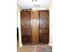 Floor to ceiling storage cabinet with wooden doors and drawers near hallway at 2120 Dakota Dr, Franklin, IN 46131