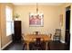 Dining room with wood table and rustic chandelier at 2120 Dakota Dr, Franklin, IN 46131
