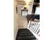 Foyer with transitional staircase leading into adjoining rooms with tile and wood floors at 2120 Dakota Dr, Franklin, IN 46131