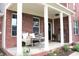 Inviting front porch with comfortable seating, decorative plants, and stylish decor at 2120 Dakota Dr, Franklin, IN 46131