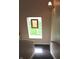 A staircase with a stained glass window overlooking the outside at 2120 Dakota Dr, Franklin, IN 46131