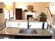 Bright kitchen featuring granite countertops, modern faucet, and open design into the living area at 2120 Dakota Dr, Franklin, IN 46131