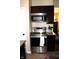 Updated kitchen featuring stainless steel stove, microwave, and dark wood cabinets at 2120 Dakota Dr, Franklin, IN 46131