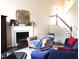 Comfortable living room featuring a fireplace, plush seating, and a staircase leading to the upper level at 2120 Dakota Dr, Franklin, IN 46131