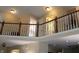Second story loft space overlooking the living area with neutral paint and modern lighting at 2120 Dakota Dr, Franklin, IN 46131