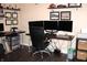 Spacious home office featuring a multi-monitor setup, dark wood desk, and ample storage, ideal for productivity at 2120 Dakota Dr, Franklin, IN 46131