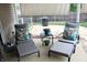 Relaxing patio with comfortable lounge chairs, accent pillows, and a cozy fire pit, perfect for outdoor enjoyment at 2120 Dakota Dr, Franklin, IN 46131
