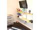 Playful room with mounted shelves displaying toys, paired with a storage unit for convenient organization at 2120 Dakota Dr, Franklin, IN 46131