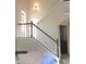 Elegant staircase with wooden banister and newel post, leading to the upper level of the home at 2120 Dakota Dr, Franklin, IN 46131