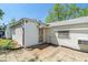Exterior view of the home with a small patio and an entrance to the home at 219 S Sherman Dr, Indianapolis, IN 46201