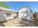 Backyard area featuring the rear exterior and an old small storage shed at 219 S Sherman Dr, Indianapolis, IN 46201