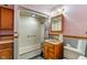 Functional bathroom featuring a shower, vanity with sink, medicine cabinet, and toilet at 219 S Sherman Dr, Indianapolis, IN 46201