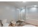 Bathroom with a shower, bath and toilet at 219 S Sherman Dr, Indianapolis, IN 46201