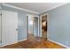 A bedroom boasts a mirrored closet and trimwork at 219 S Sherman Dr, Indianapolis, IN 46201