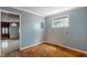 Cozy bedroom featuring a window and an open doorway at 219 S Sherman Dr, Indianapolis, IN 46201
