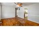 Spacious living room featuring hardwood floors, neutral walls, and doorway view into the kitchen at 219 S Sherman Dr, Indianapolis, IN 46201