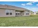 A large backyard with well-maintained lawn, and a view of the home's exterior at 2257 Aviary Ln, Danville, IN 46122