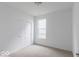 Cozy bedroom featuring a window, carpet, and a closet at 2257 Aviary Ln, Danville, IN 46122