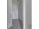 Compact walk-in closet with built in shelving, carpeted floor and ample storage space at 2257 Aviary Ln, Danville, IN 46122