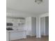Modern kitchen featuring white cabinets, stainless steel appliances, and a center island with a sink at 2257 Aviary Ln, Danville, IN 46122