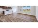 Open-concept kitchen and living space with an island, stainless steel appliances, and lots of natural light at 2257 Aviary Ln, Danville, IN 46122