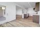 Open-concept kitchen and living space with island, stainless appliances and patio access at 2257 Aviary Ln, Danville, IN 46122