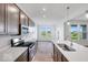 Modern kitchen with stainless steel appliances, white countertops, and a center island with a sink at 2257 Aviary Ln, Danville, IN 46122