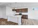 Well-lit kitchen with white countertops, an island with a sink, and stainless steel appliances at 2257 Aviary Ln, Danville, IN 46122