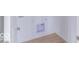Compact laundry room with wood-style floors and hookups for washer and dryer at 2257 Aviary Ln, Danville, IN 46122