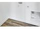 Laundry room featuring wood plank flooring and white walls with the connections visible at 2257 Aviary Ln, Danville, IN 46122