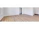 Bright living room with wood flooring, white walls, and large windows providing ample natural light at 2257 Aviary Ln, Danville, IN 46122