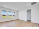 Spacious living room with wood flooring, white walls, and large windows providing ample natural light at 2257 Aviary Ln, Danville, IN 46122