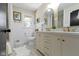 Bright bathroom with double vanity, stylish mirrors, and neutral decor at 2325 Melody Ln, Anderson, IN 46012