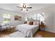 Bright bedroom with large windows, hardwood floors, comfortable seating, and stylish decor at 2325 Melody Ln, Anderson, IN 46012