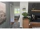 Cozy bedroom features a patterned comforter, accent decor, and a view of the outdoors at 2325 Melody Ln, Anderson, IN 46012