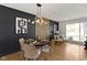 Inviting dining space featuring contemporary lighting and comfortable seating at 2325 Melody Ln, Anderson, IN 46012