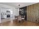 Charming dining area with a modern light fixture adjacent to a bright updated kitchen at 2325 Melody Ln, Anderson, IN 46012