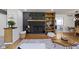 Inviting living room featuring a stylish fireplace and adjacent built-in shelving at 2325 Melody Ln, Anderson, IN 46012