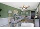 Inviting living room offers comfortable seating, ceiling fan and stylish decor at 2325 Melody Ln, Anderson, IN 46012