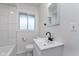 Modern bathroom with updated vanity, mirror, toilet, and tile flooring at 2539 E 68Th St, Indianapolis, IN 46220