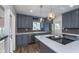 Modern kitchen with stainless appliances, quartz countertops, and stylish pendant lighting at 2539 E 68Th St, Indianapolis, IN 46220