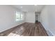 Bright living room featuring new floors, neutral paint, modern lighting, and ample space at 2539 E 68Th St, Indianapolis, IN 46220