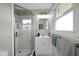 Bathroom featuring a glass-enclosed shower and a modern vanity with stylish fixtures at 2610 S Sheridan Ave, Indianapolis, IN 46203